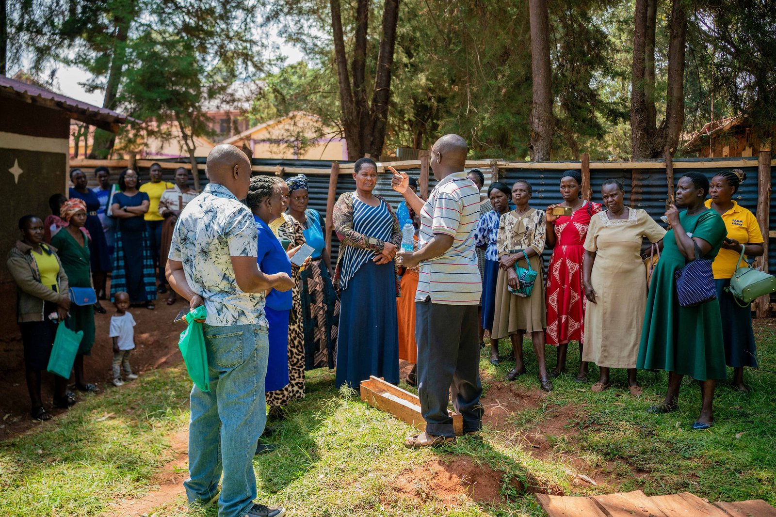 Kenyan women participating in a community financial meeting